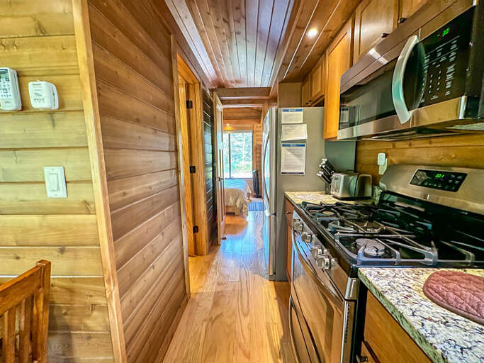 Past the kitchen you will find the bathroom and bedroom.