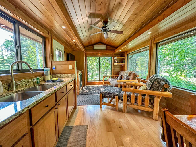 The kitchen is located off of the living room.