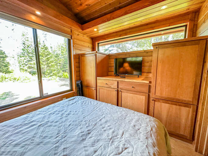 There is also a TV in the bedroom.