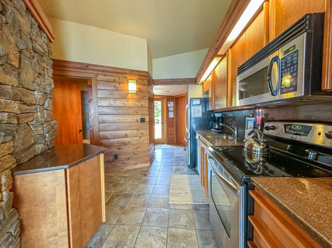 The kitchen features stainless steel appliances.