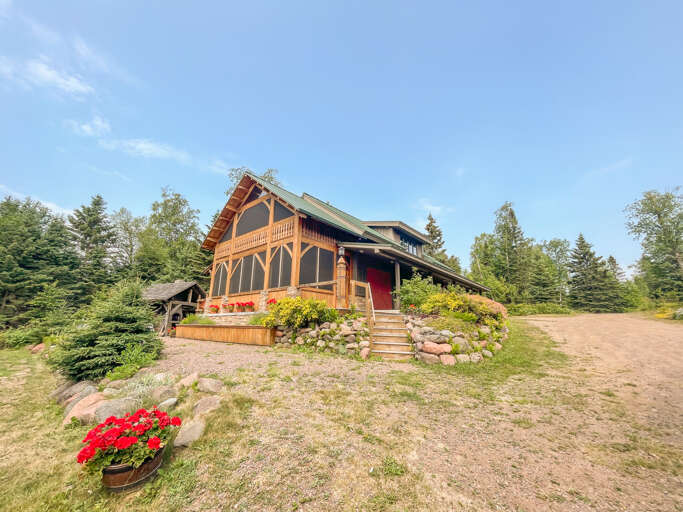 Serenity Loft is located above the adjoining building on the property and features two bedrooms and one bathroom in a loft-apartment style home with a North Woods twist.