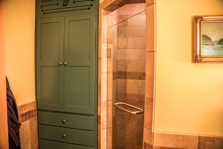 The guest bathroom located on the main level offers a walk-in shower. The guest bathroom located on the main level offers a walk-in shower.