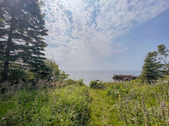 A walkway leads you to a 300 foot section of Lake Superior.