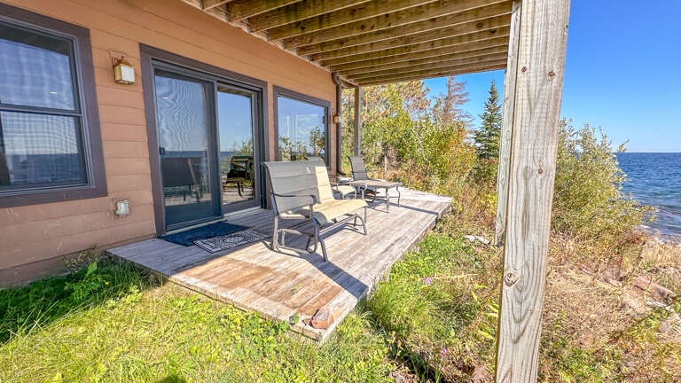 Step out from the lower level living room onto the patio.