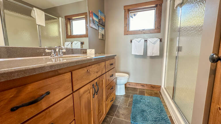Bathroom 2 has a walk-in shower and is located on the upper level.
