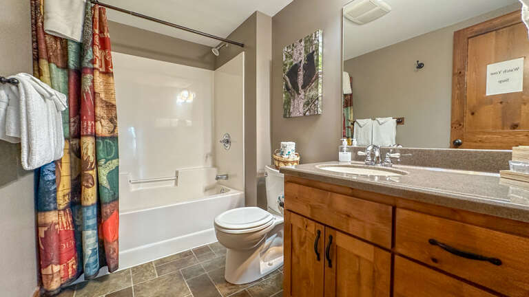 Bathroom 3 has a shower/tub combo and is located on the lower level.
