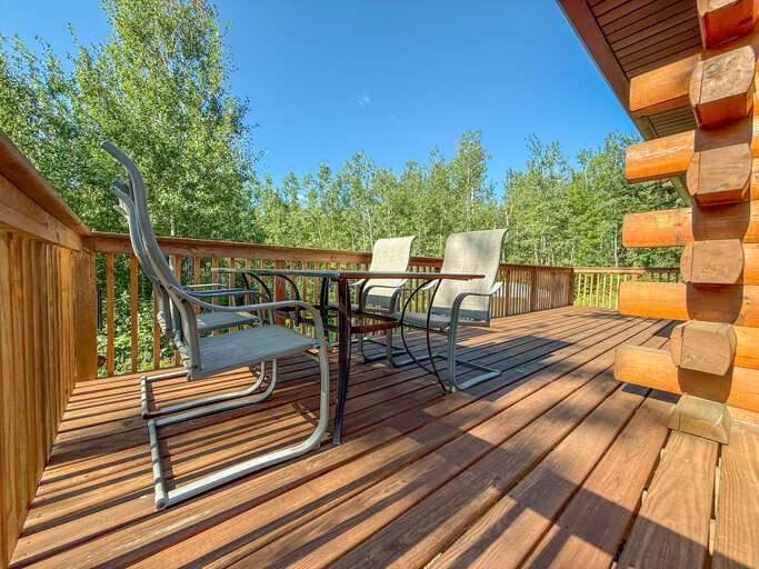 Sawtooth Chalet's spacious deck includes seasonal furniture you can enjoy during your stay.