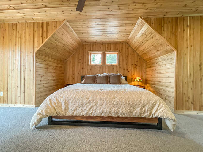 It features a large king bed.