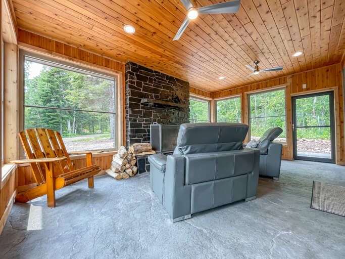 Step out onto the 4-season porch and enjoy a good book