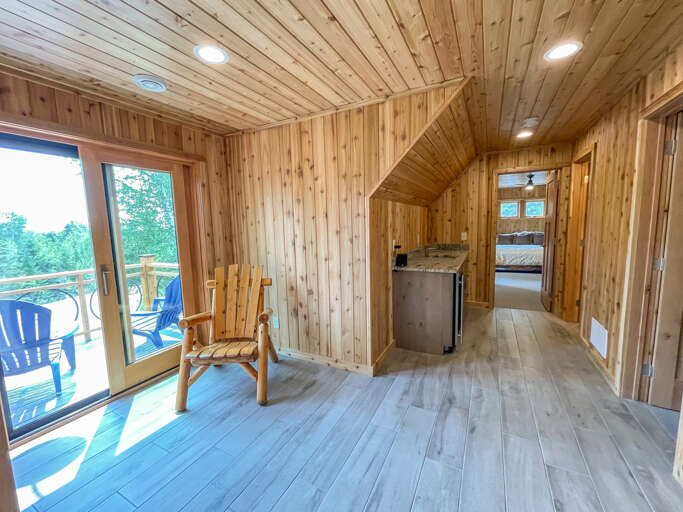 The upper level hallway offers a little sitting area