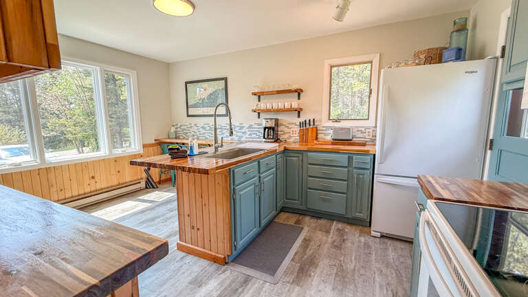 Enter the home into the kitchen.