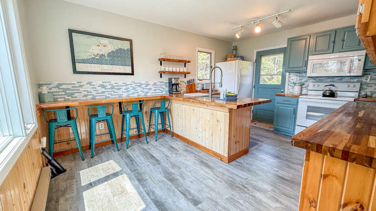 Kitchen with countertop dining.