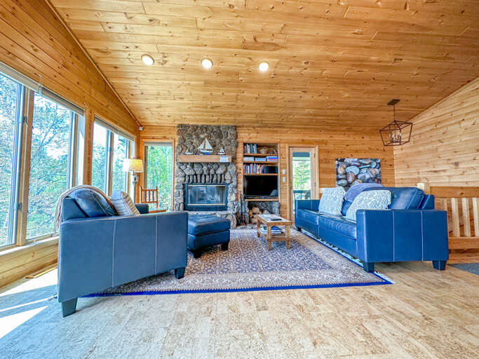 The home features both a main level and lower level living rooms. This is the main level living room.