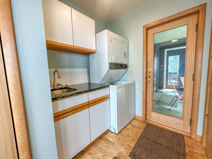 There is a laundry room off of the kitchen.