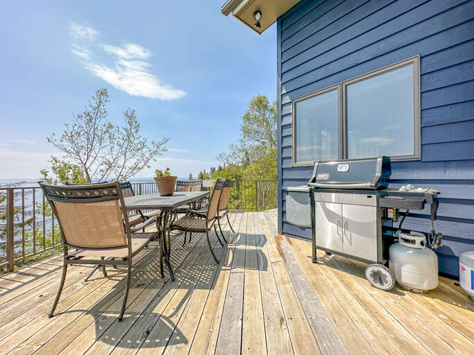 The main level deck can be accessed from the living room, kitchen, or reading nook.