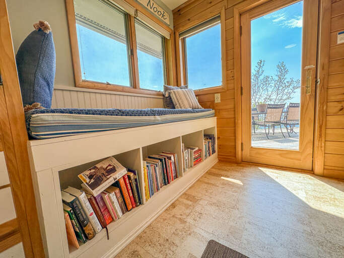 Small library in the reading nook.
