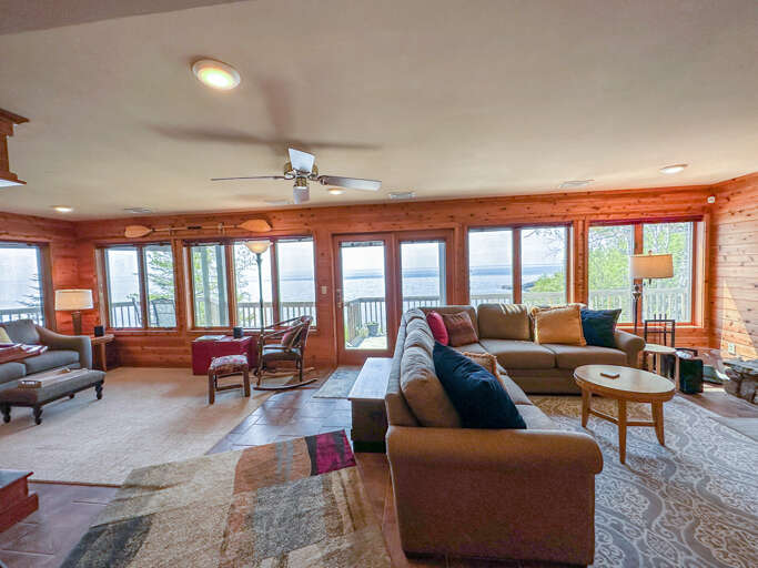 This room also takes advantage of the sweeping Lake Superior views with large windows.
