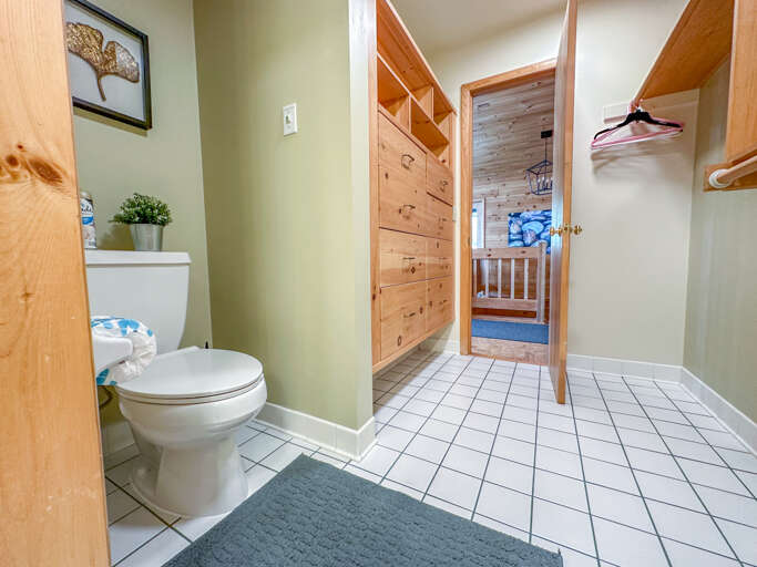 Bathroom located off of Bedroom 1 can also be accessed from the main level entryway hallway.
