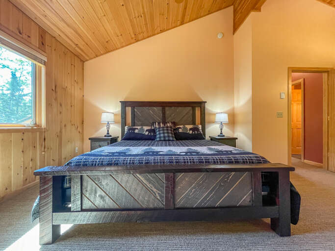 This spacious bedroom is located on the upper level