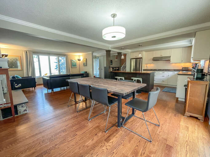 The dining room offers room for 8 to sit at the table with two additional seat at the kitchen counter