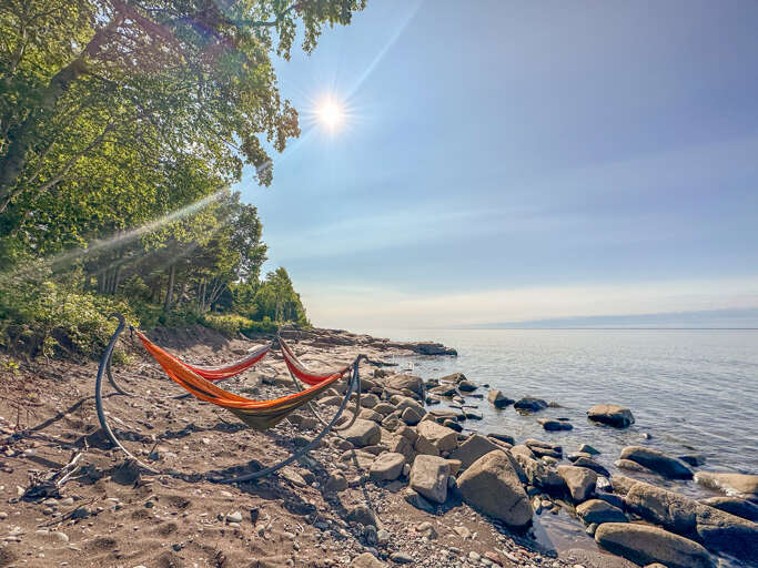 Multiple guests can take advantage of the triple hammocks on the beach
