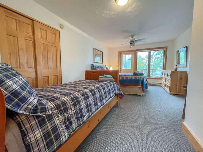 Bedroom two is also located on the upper level and it offers a queen bed and a twin bed