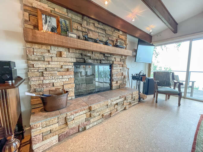 The living room has a wood-burning fireplace