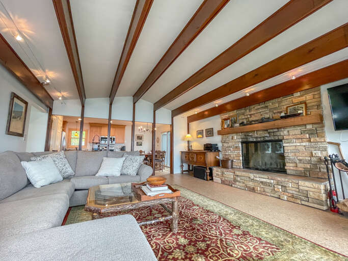 The open layout living space allows groups to spend precious vacation moments together, no matter what they are doing.