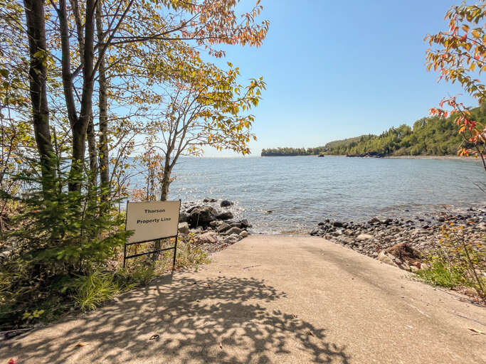 The shoreline is clearly marked with these white signs.