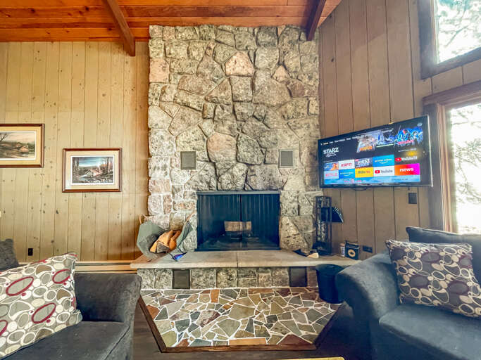 Light a fire in the wood burning fireplace on a chilly night