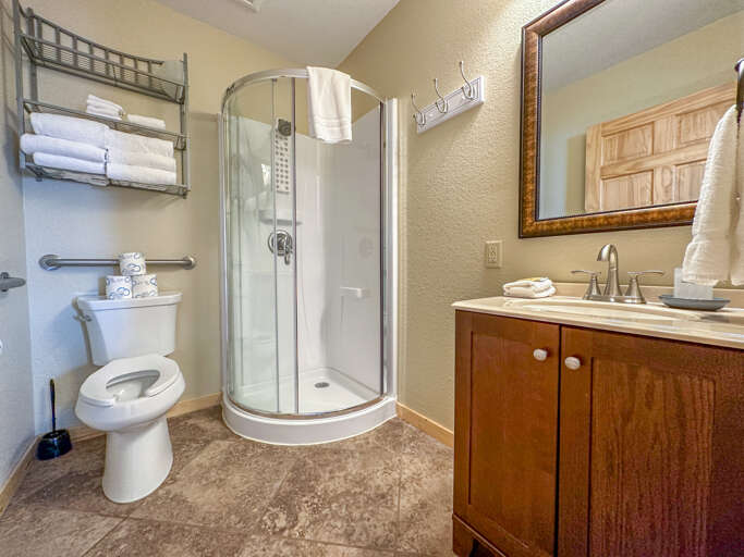 On the other side of the studio is a 3-piece bathroom with a walk in shower.
