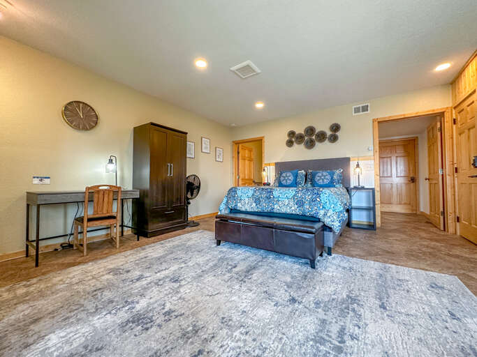 Inside, the spacious bedroom area has a queen-sized bed.