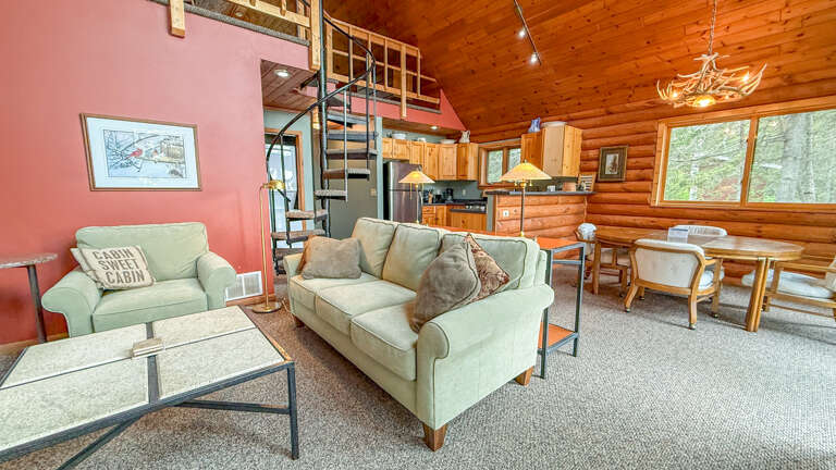 Cozy up in your rustic cabin retreat with comfortable seating, full kitchen, and warm wood details perfect for mountain getaways.