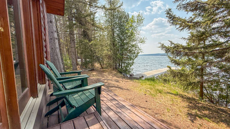 Relax in these lakefront Adirondack chairs while the gentle waves and forest sounds create your perfect waterside retreat.