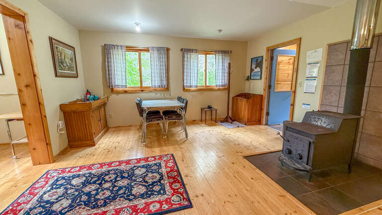 Step into your cozy retreat with warm wood floors, a crackling fireplace, and dining space where you'll gather for memorable meals.
