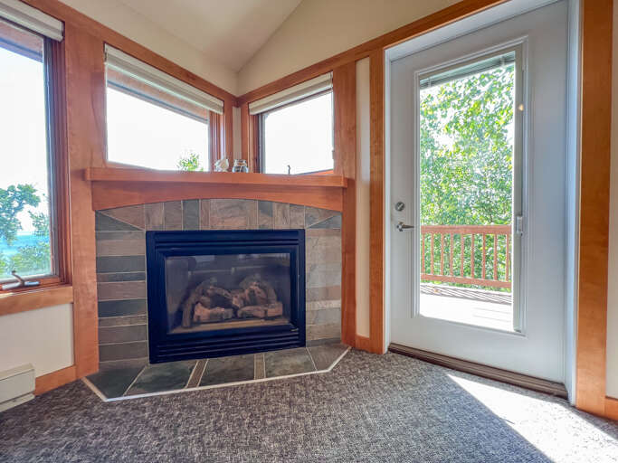 Poplar River Condo 613 Ridgeline King Guestroom features a gas fireplace