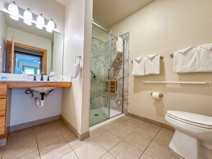 The bathroom offers a walk -in shower