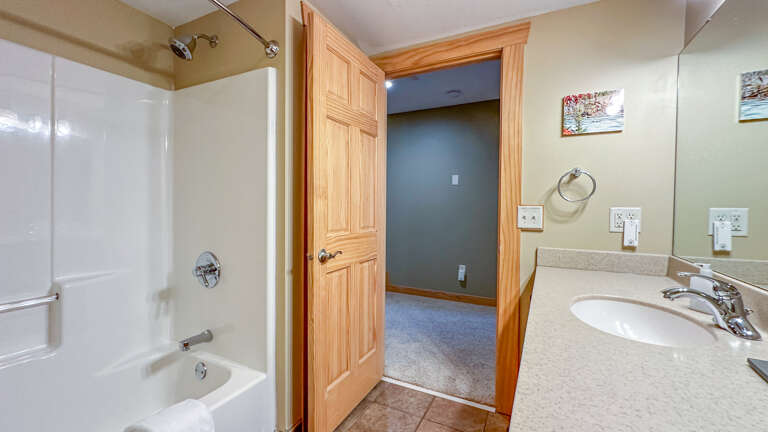 Bathroom 3 has a shower/tub combo.