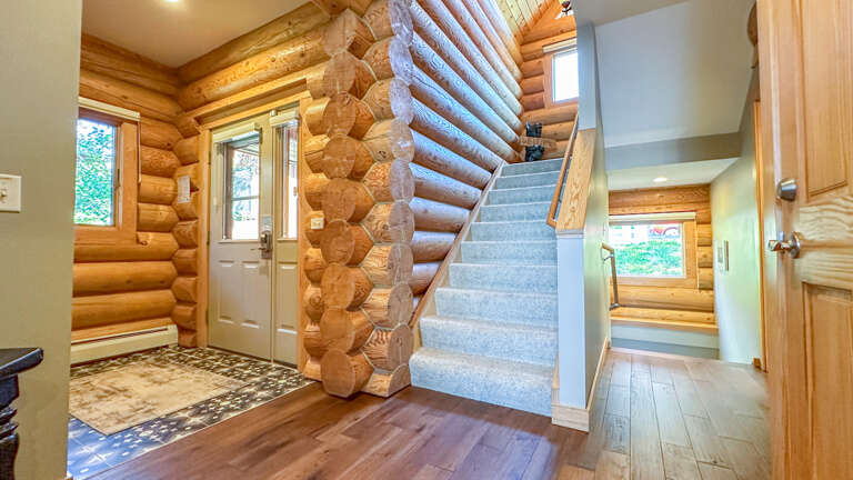 Entryway and stairs leading up and down.