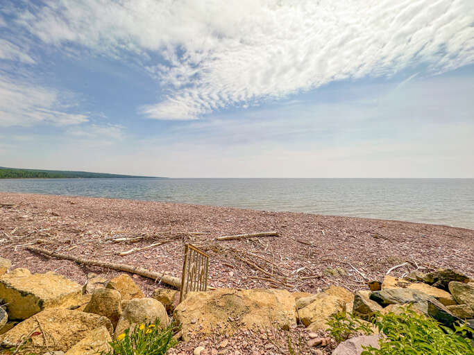 Dip your toes into the cool Lake Superior waters.