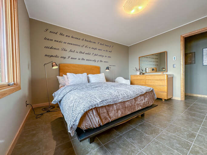 Queen bed in Bedroom 2.