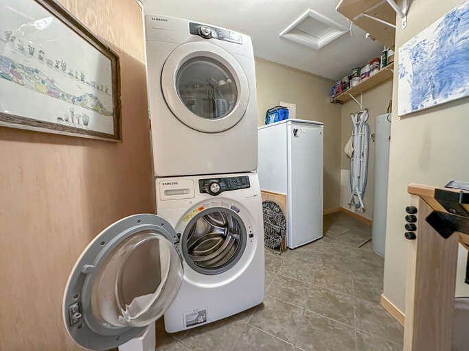 Washer/dryer and freezer off of the kitchen.