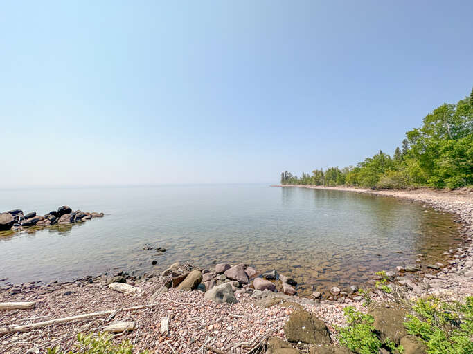 This beautiful home sits on a large stretch of private Lake Superior shoreline.