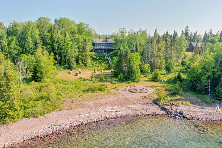 This unique home sits along one of the most desirable stretches of Lake Superior shoreline just a couple of miles from downtown Grand Marais, Minnesota.