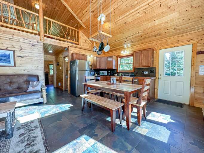 Enjoy a meal at the dining room table. Enjoy a meal at the dining room table.