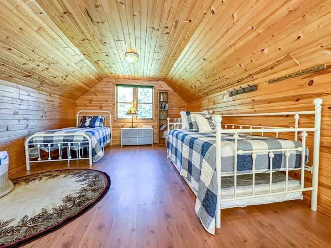 The loft bedroom offers  a twin bed and a twin trundle bed The loft bedroom offers  a twin bed and a twin trundle bed