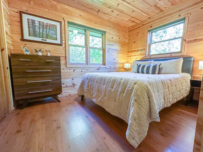 Relax on the queen bed after a day full of fun Relax on the queen bed after a day full of fun