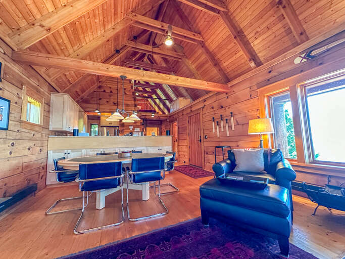 Dining area leading into the main level living room.