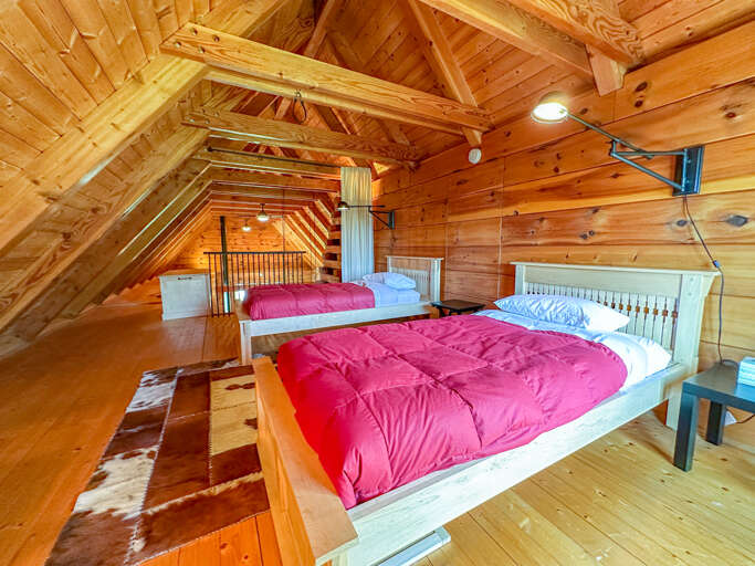 Loft bedroom with two twin beds.