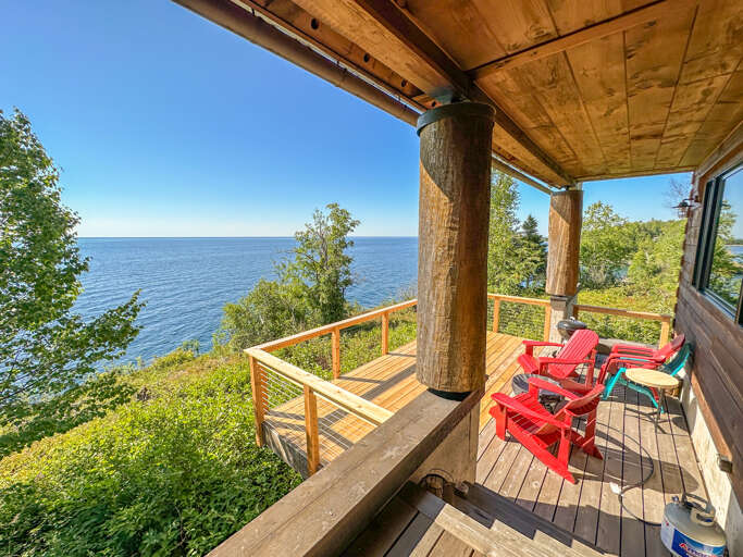Step out of the main level living room to the lake-facing deck.
